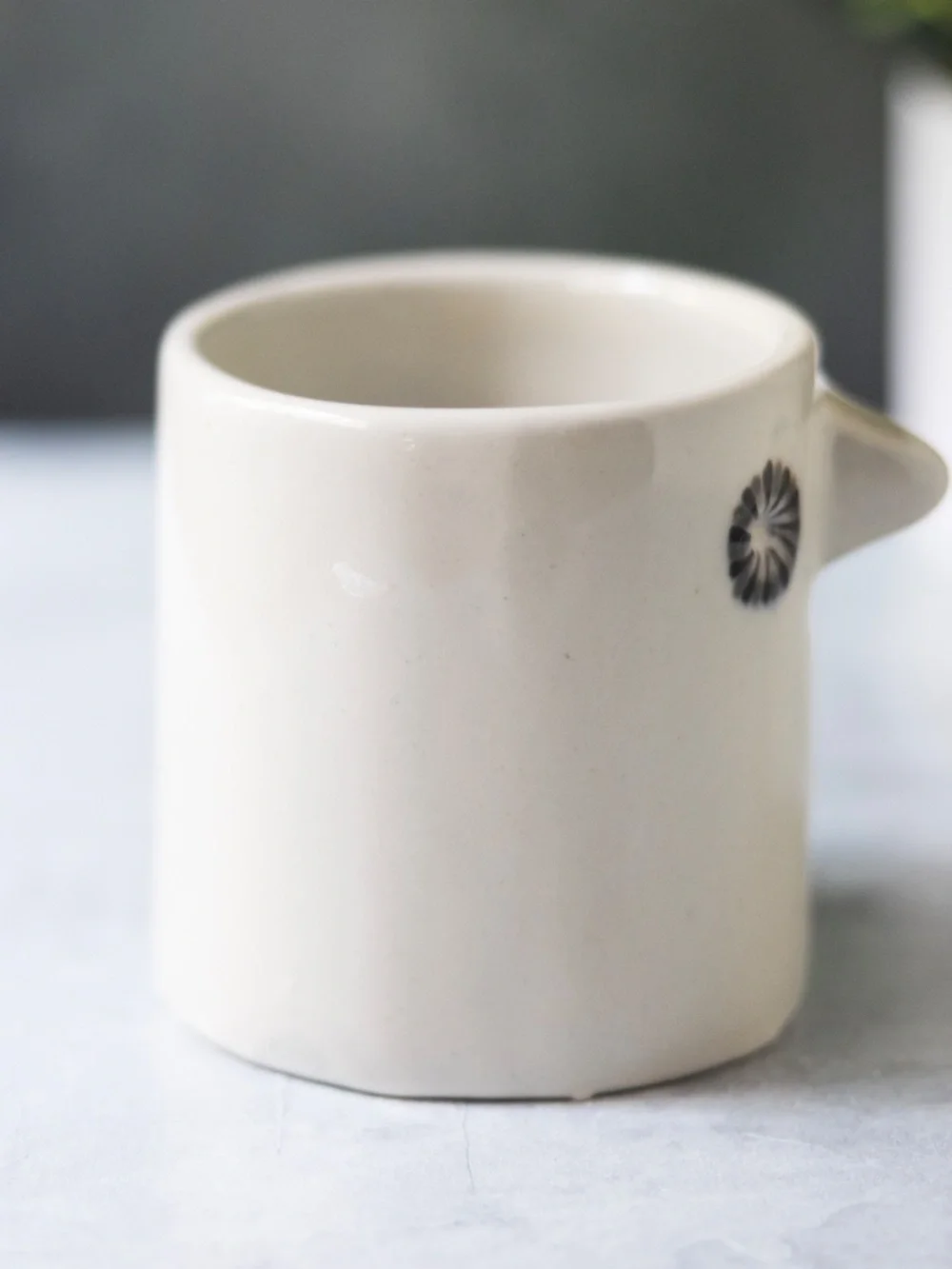West Elm white ceramic bird planter with beak and gray black eyes 3.75